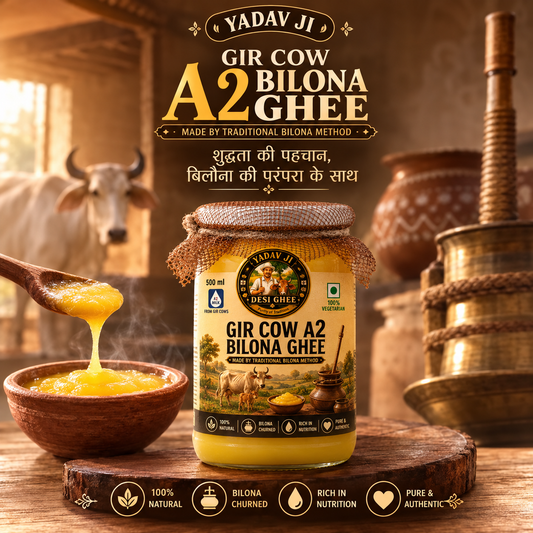 A jar of Yadav Ji Gir Cow A2 Bilona Ghee is displayed on a wooden surface with a wooden spoon dripping golden ghee into a small bowl, set against a rustic background featuring a cow and traditional cooking vessels. Text overlays highlight the product's traditional bilona method and key benefits.